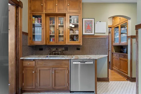 a kitchen with stainless steel appliances granite countertop a stove and a refrigerator