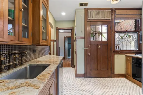 a kitchen with a sink stove and refrigerator