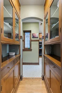 a kitchen with a refrigerator and window