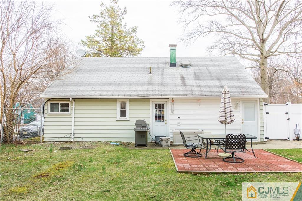 53 Ashley Road Edison, NJ 08817 - Photo 11 of 13 a view of a house with backyard and sitting area