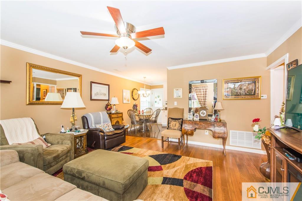 53 Ashley Road Edison, NJ 08817 - Photo 4 of 13 a living room with furniture kitchen view and a large window