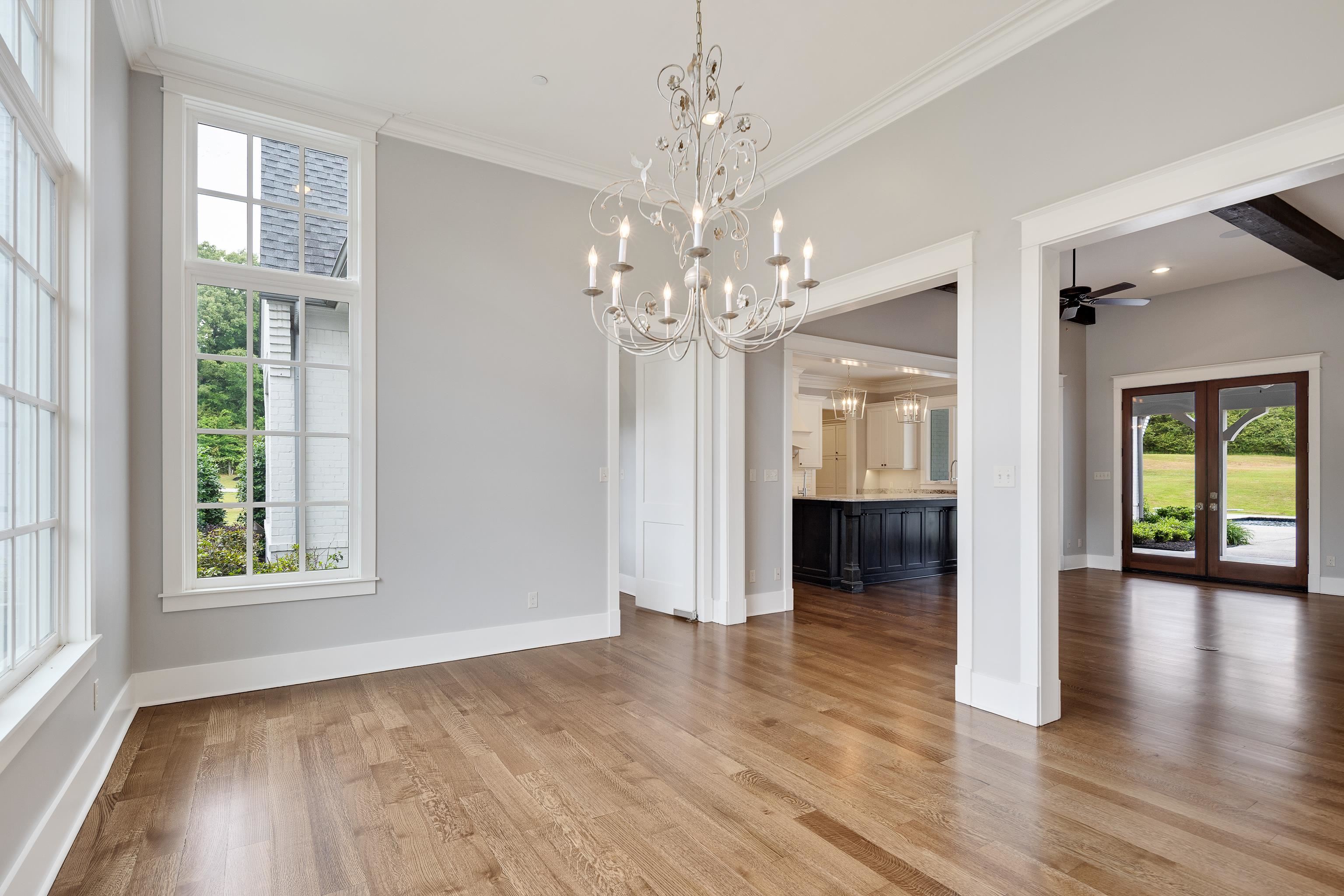 55 East Old State Line Road Piperton, TN 38017 - Photo 17 of 40 Spacious room with wood-finish flooring, an ornate chandelier, and extensive crown molding