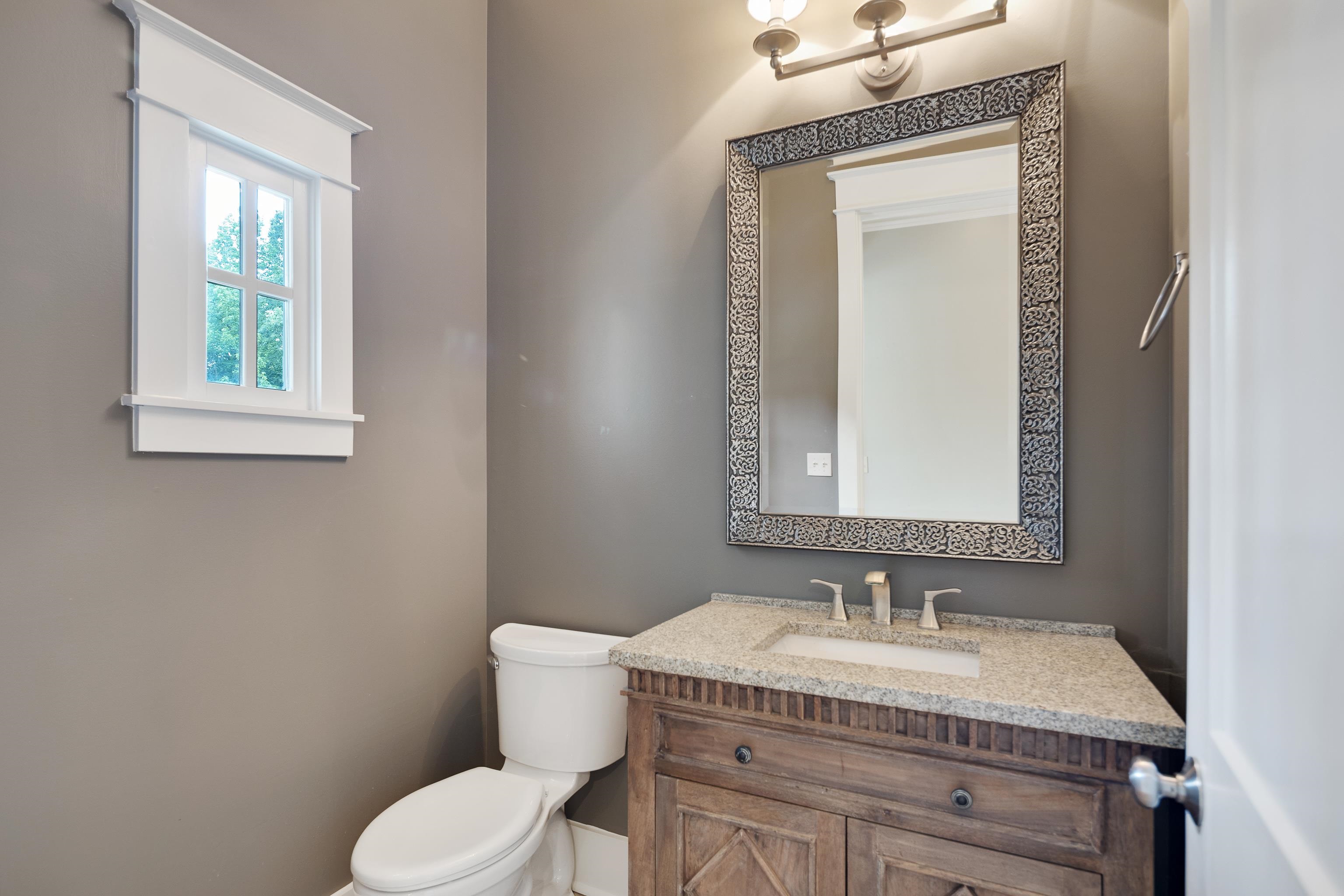 55 East Old State Line Road Piperton, TN 38017 - Photo 19 of 40 Vanity with a light-colored countertop, undermount sink, and brushed nickel faucet hardware