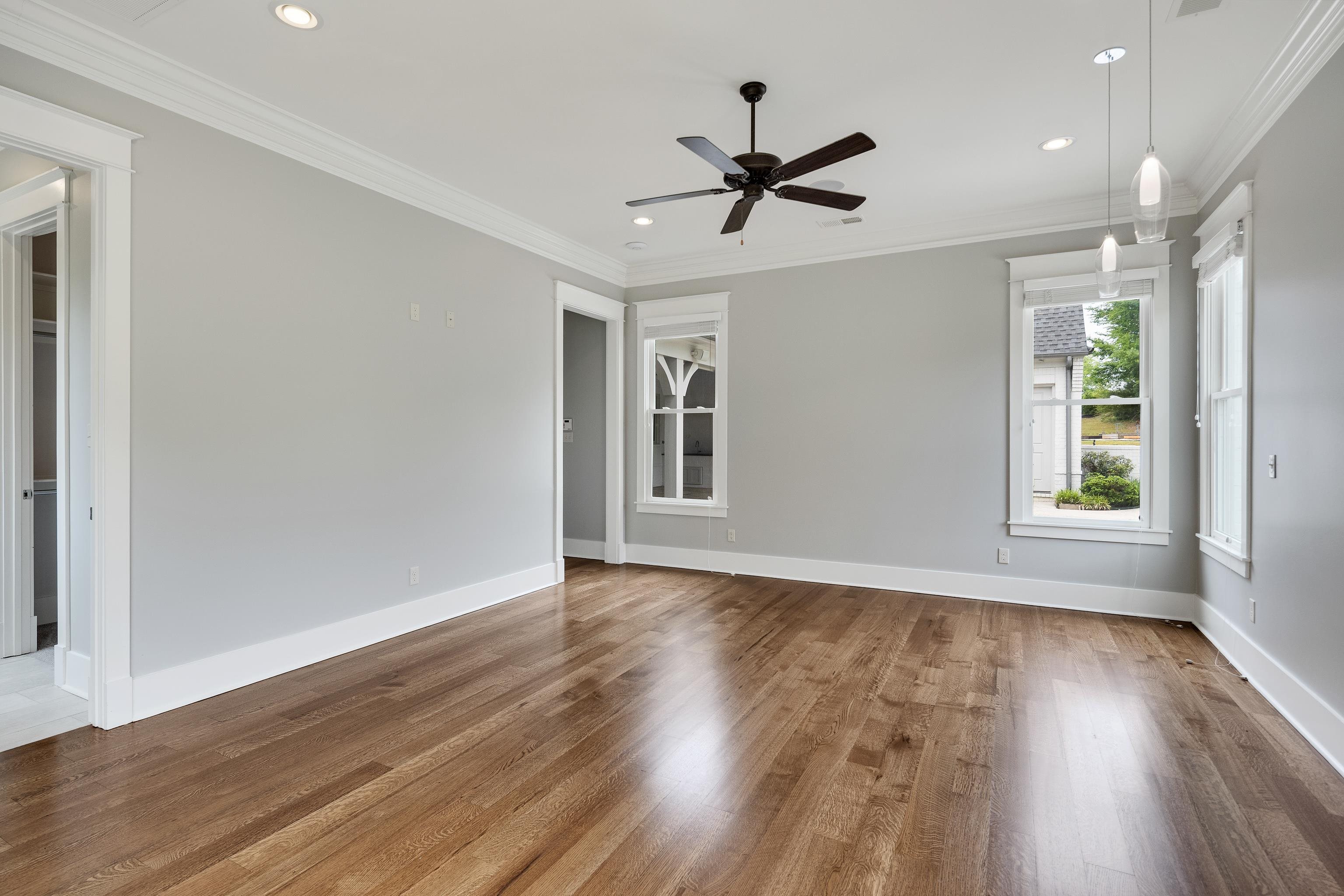 55 East Old State Line Road Piperton, TN 38017 - Photo 22 of 40 Spacious room featuring wood flooring, recessed lighting, a ceiling fan, and multiple windows with white trim
