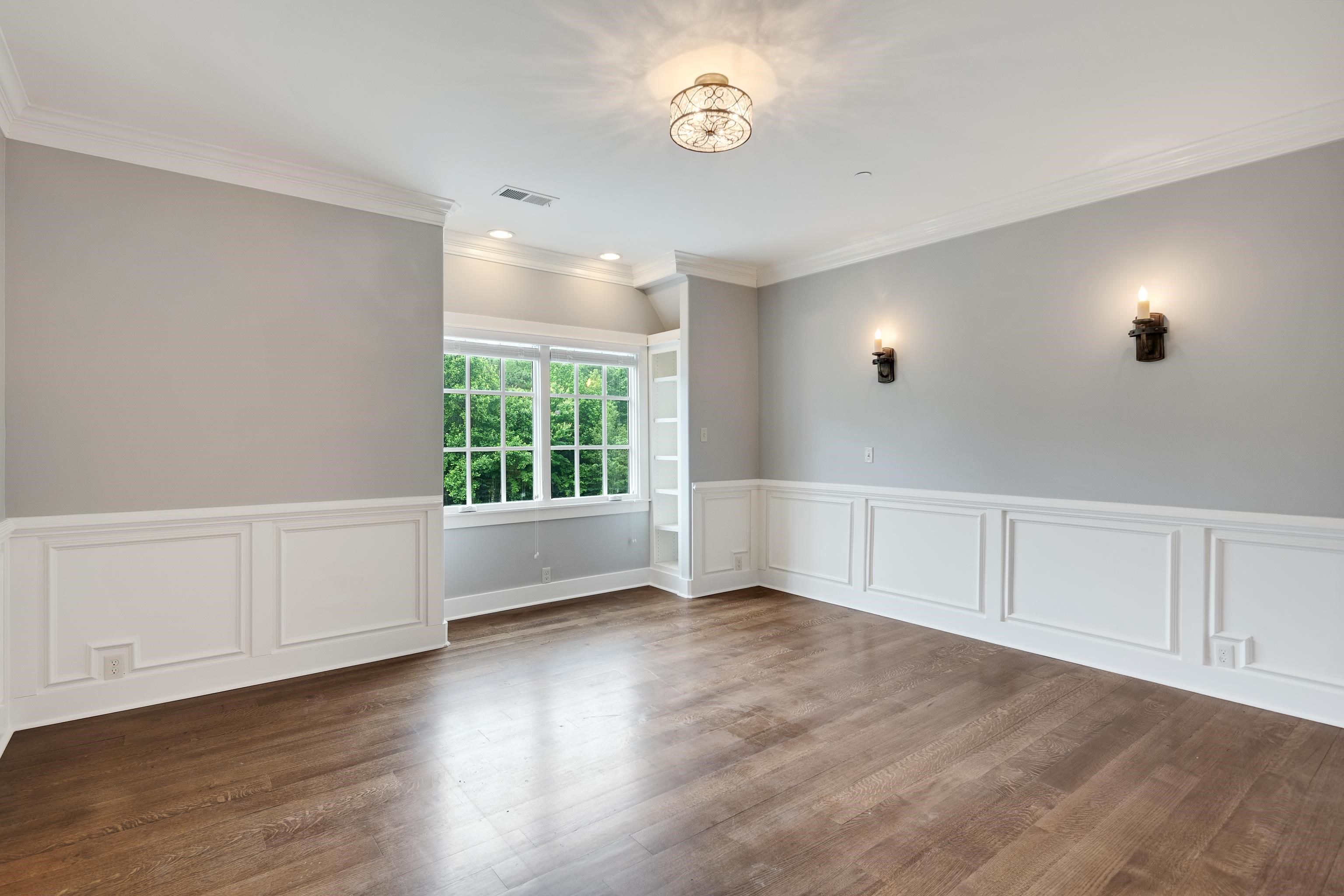 55 East Old State Line Road Piperton, TN 38017 - Photo 30 of 40 Open room featuring wood-finish flooring, wainscoting, and crown molding