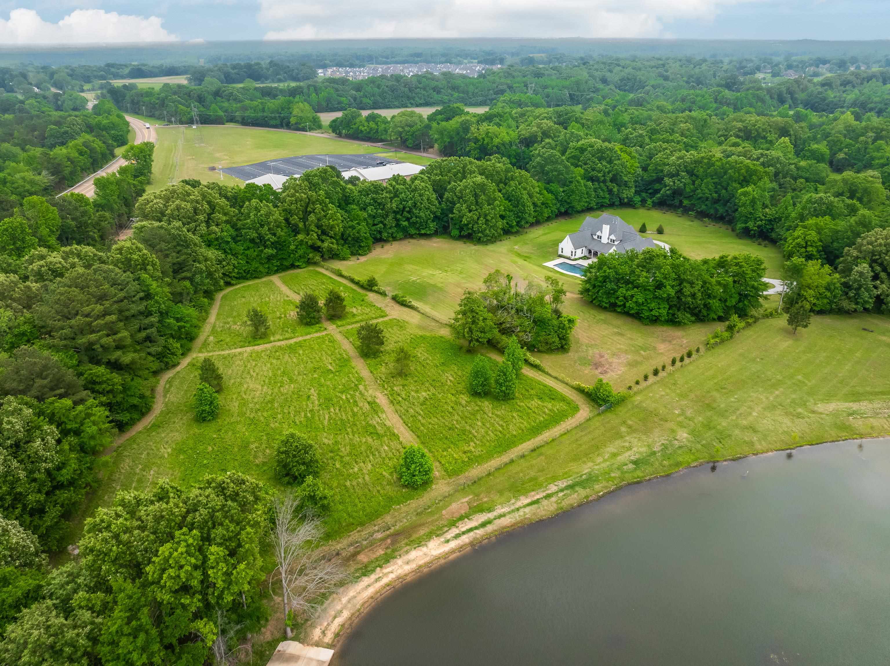 55 East Old State Line Road Piperton, TN 38017 - Photo 39 of 40 Expansive estate featuring a large main residence, private swimming pool, and lake frontage