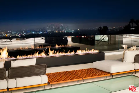 a view of a house with a large tree