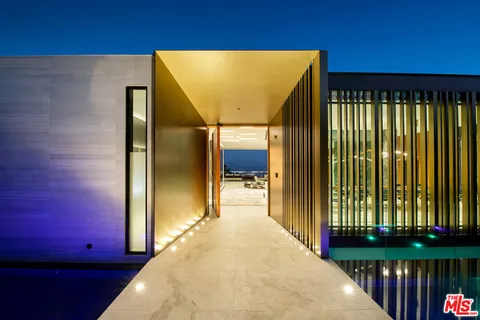 a lobby with furniture and a floor to ceiling window