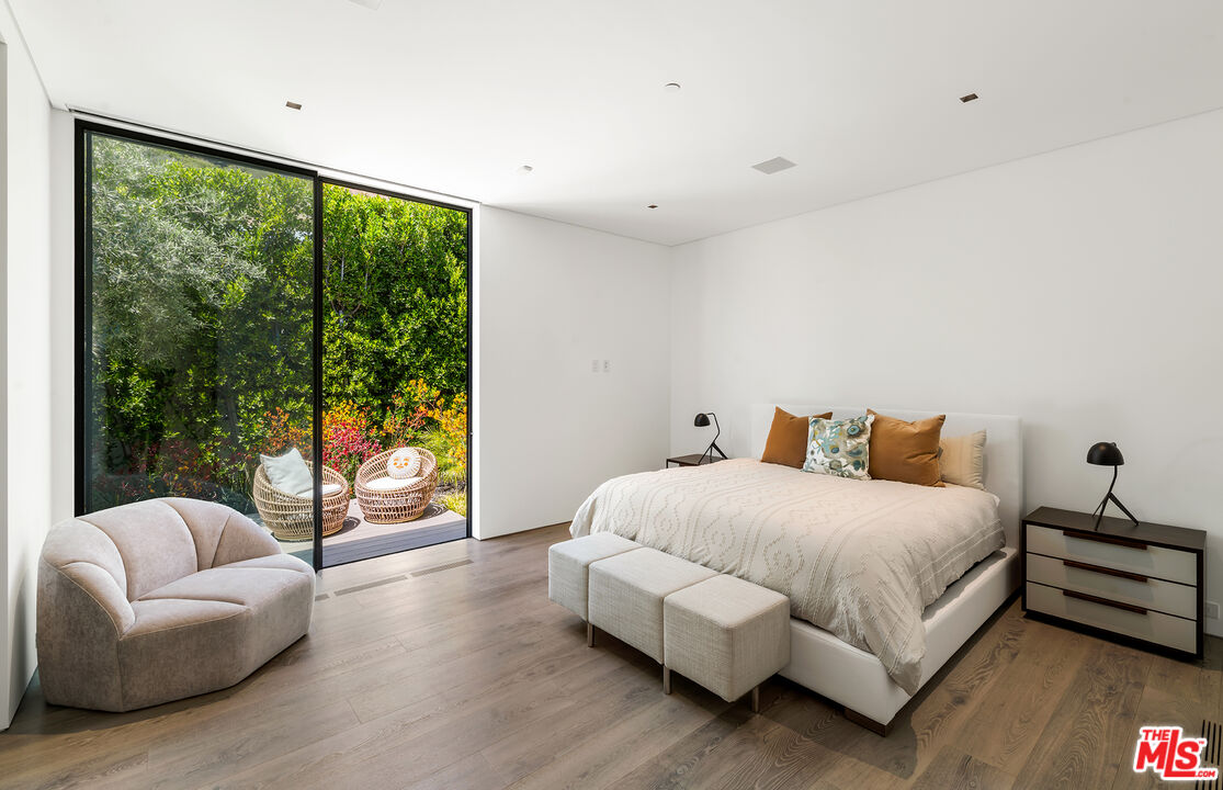 1108 Wallace Ridge Beverly Hills, CA 90210 - Photo 56 of 74 a bedroom with a bed and a large window