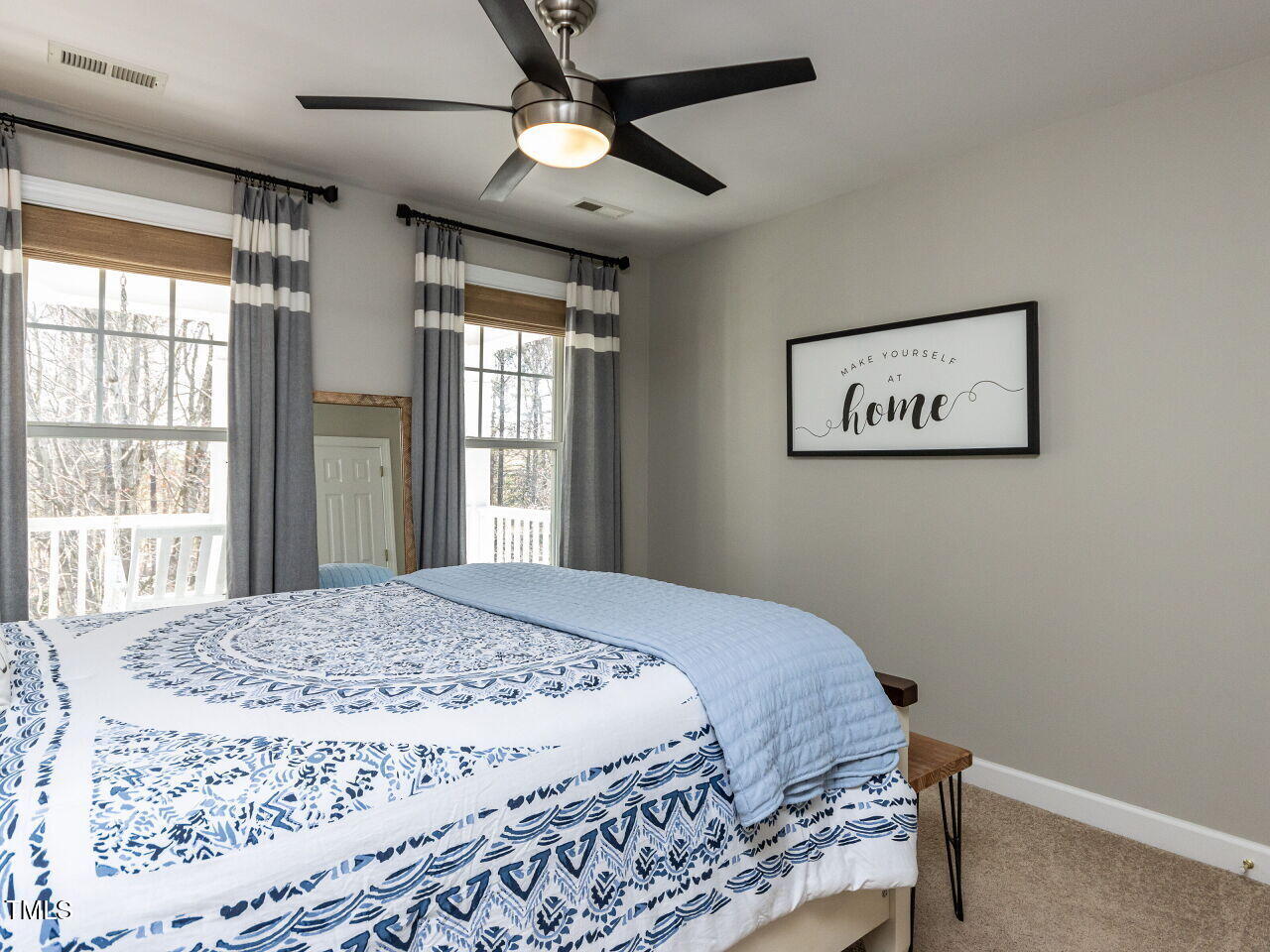 2019 Falls River Avenue Raleigh, NC 27614 - Photo 22 of 40 Secondary bedroom with custom shades and curtains, updated ceiling fan.