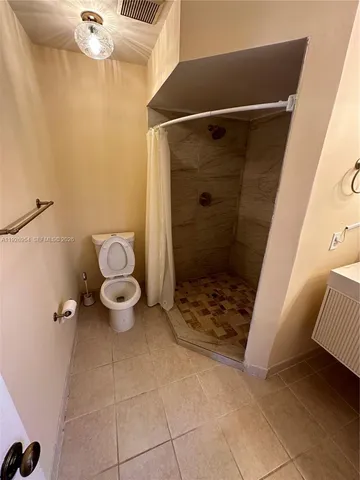 a bathroom with a toilet and a sink