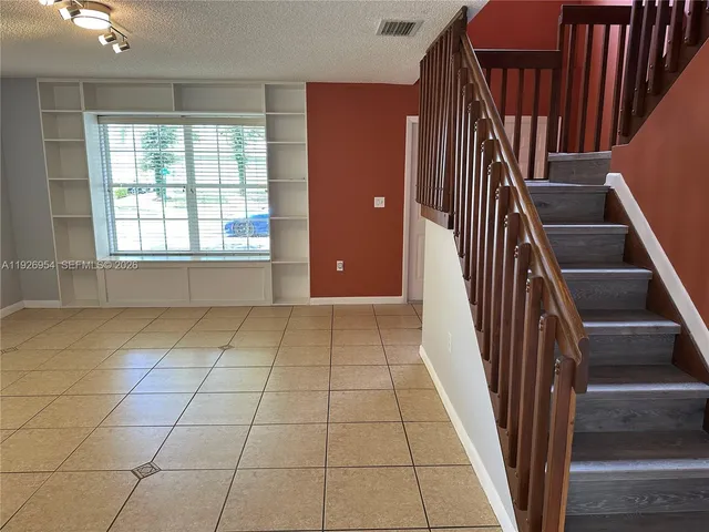 a view of a livingroom with a staircase