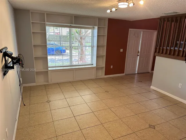a view of an empty room and window