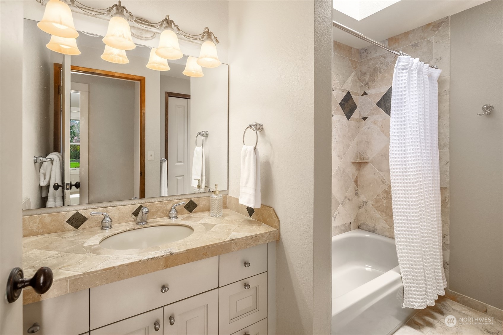 3905 108th Street Southeast Everett, WA 98208 - Photo 15 of 28 a bathroom with a granite countertop sink mirror and shower
