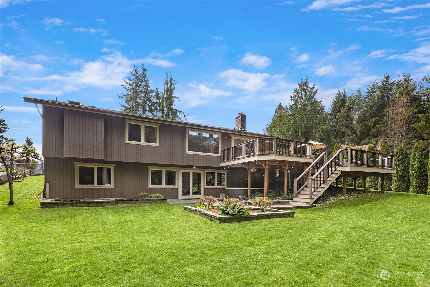 3905 108th Street Southeast Everett, WA 98208 - Photo 20 of 28 a front view of a house with a yard table and chairs