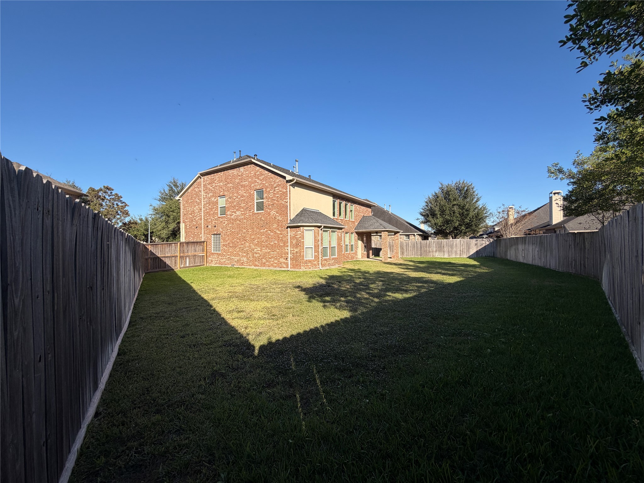 28015 Silverstream Court Fulshear, TX 77441 - Photo 33 of 33 a view of an house with backyard and garden