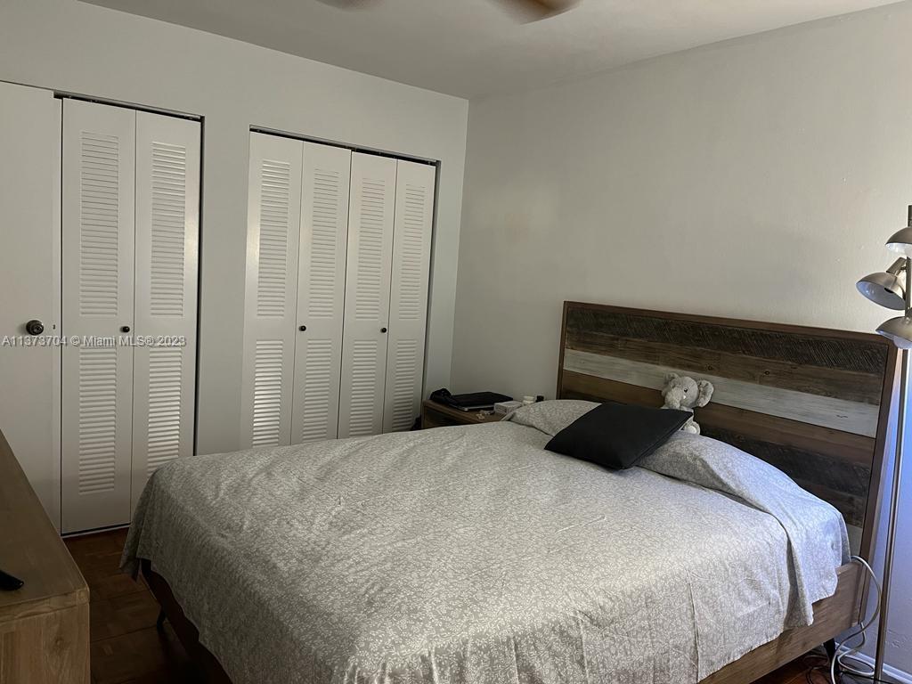 8340 Sands Point Boulevard, Unit P309 Tamarac, FL 33321 - Photo 13 of 33 a bedroom with a bed and a dresser
