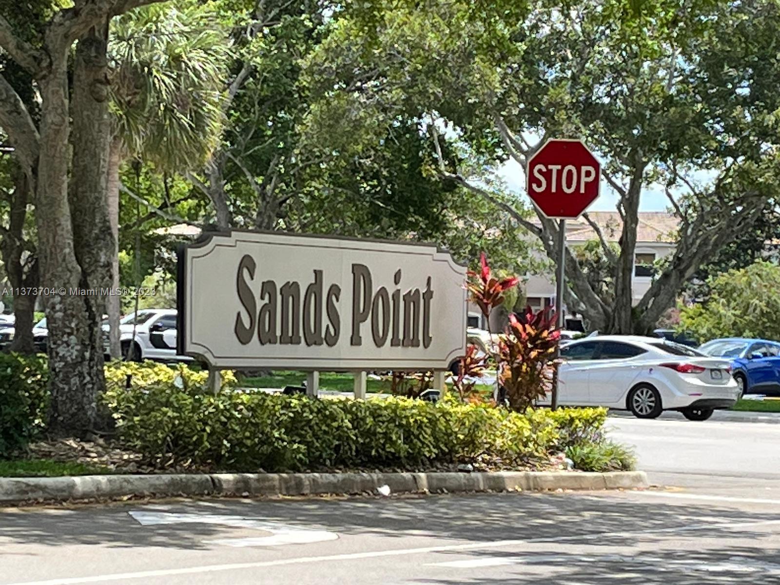 8340 Sands Point Boulevard, Unit P309 Tamarac, FL 33321 - Photo 15 of 33 a street sign on a pole on a street