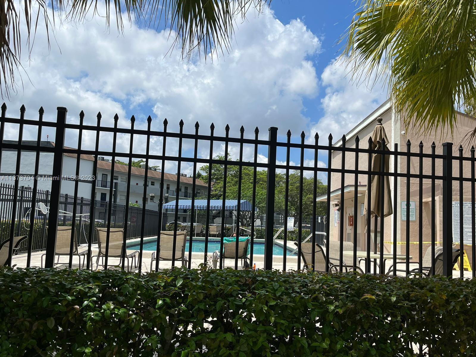 8340 Sands Point Boulevard, Unit P309 Tamarac, FL 33321 - Photo 22 of 33 a view of swimming pool from a balcony