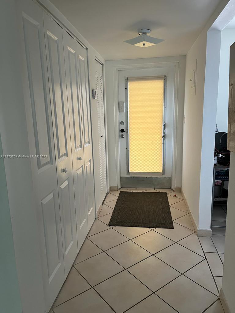 8340 Sands Point Boulevard, Unit P309 Tamarac, FL 33321 - Photo 8 of 33 a bathroom with a granite countertop shower and a window
