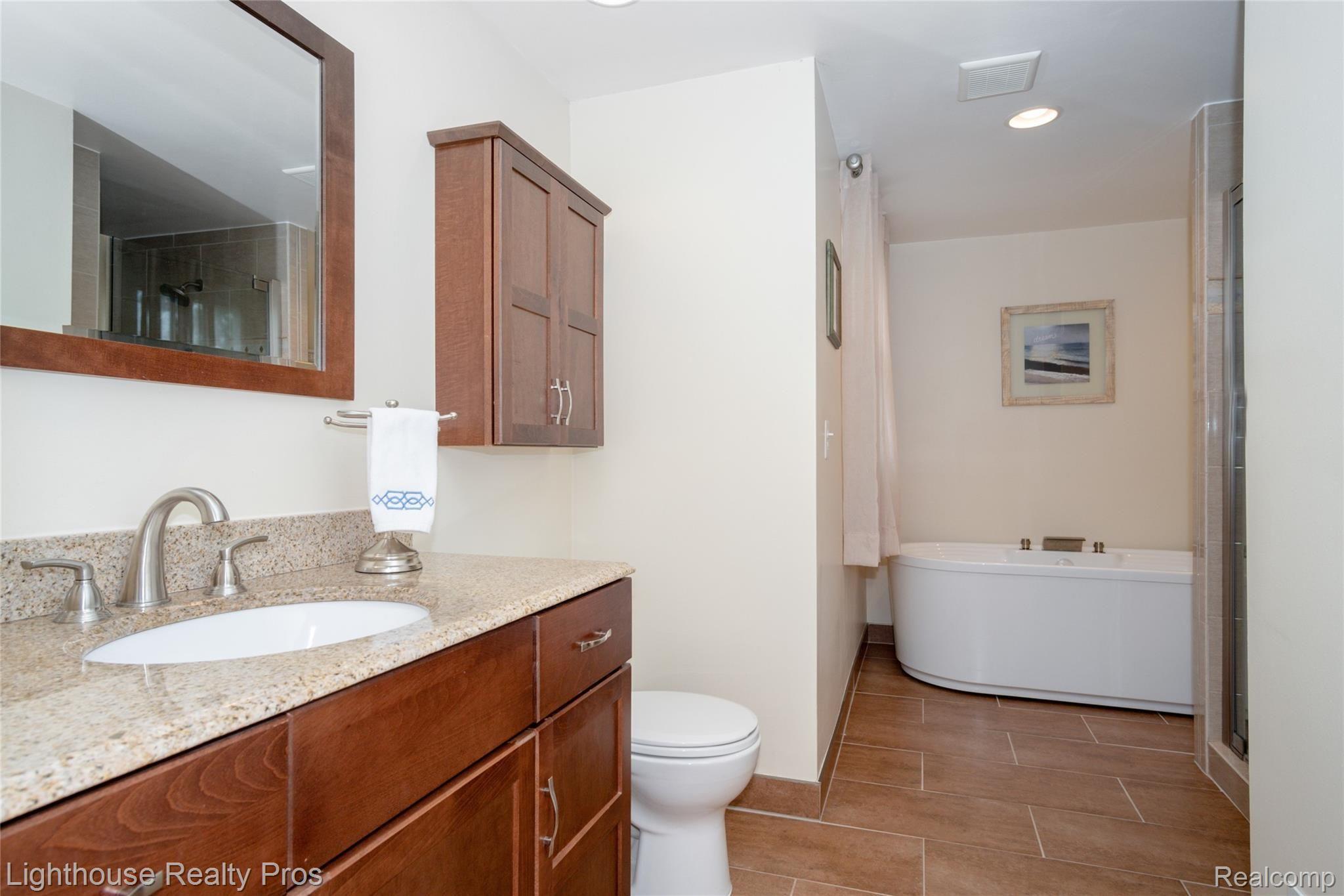 8773 Hyne Road Brighton, MI 48114 - Photo 21 of 38 Beautifully updated master bath with ceramic flooring