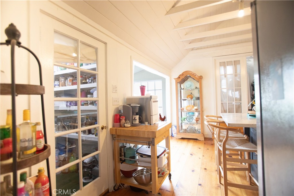 5963 Schilling Road Coulterville, CA 95311 - Photo 15 of 75 a living room with furniture a flat screen tv and a floor to ceiling window