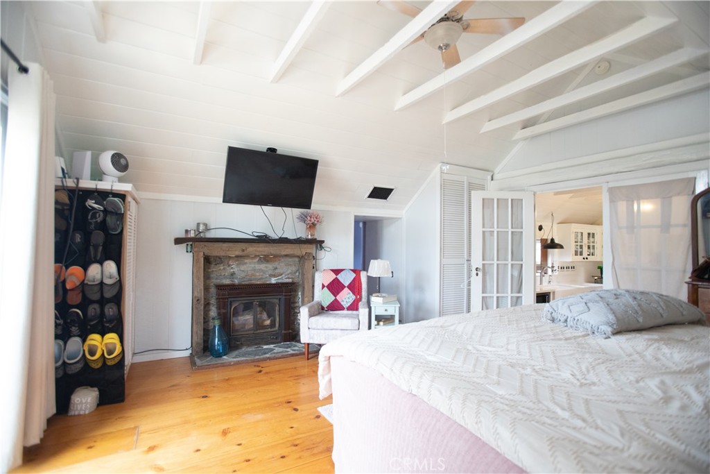 5963 Schilling Road Coulterville, CA 95311 - Photo 17 of 75 a bedroom with a bed and a fireplace