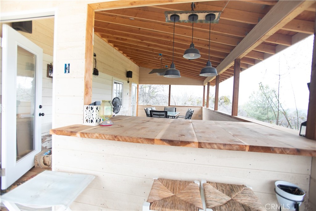5963 Schilling Road Coulterville, CA 95311 - Photo 22 of 75 a bathroom with a granite countertop sink and mirror