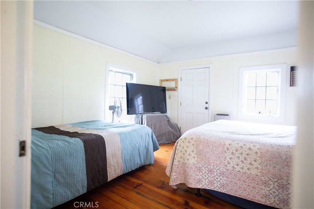 5963 Schilling Road Coulterville, CA 95311 - Photo 34 of 75 a bedroom with a bed and a night stand