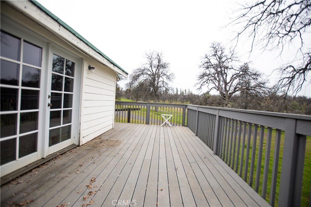 5963 Schilling Road Coulterville, CA 95311 - Photo 36 of 75 a view of balcony with wooden floor and fence and a porch