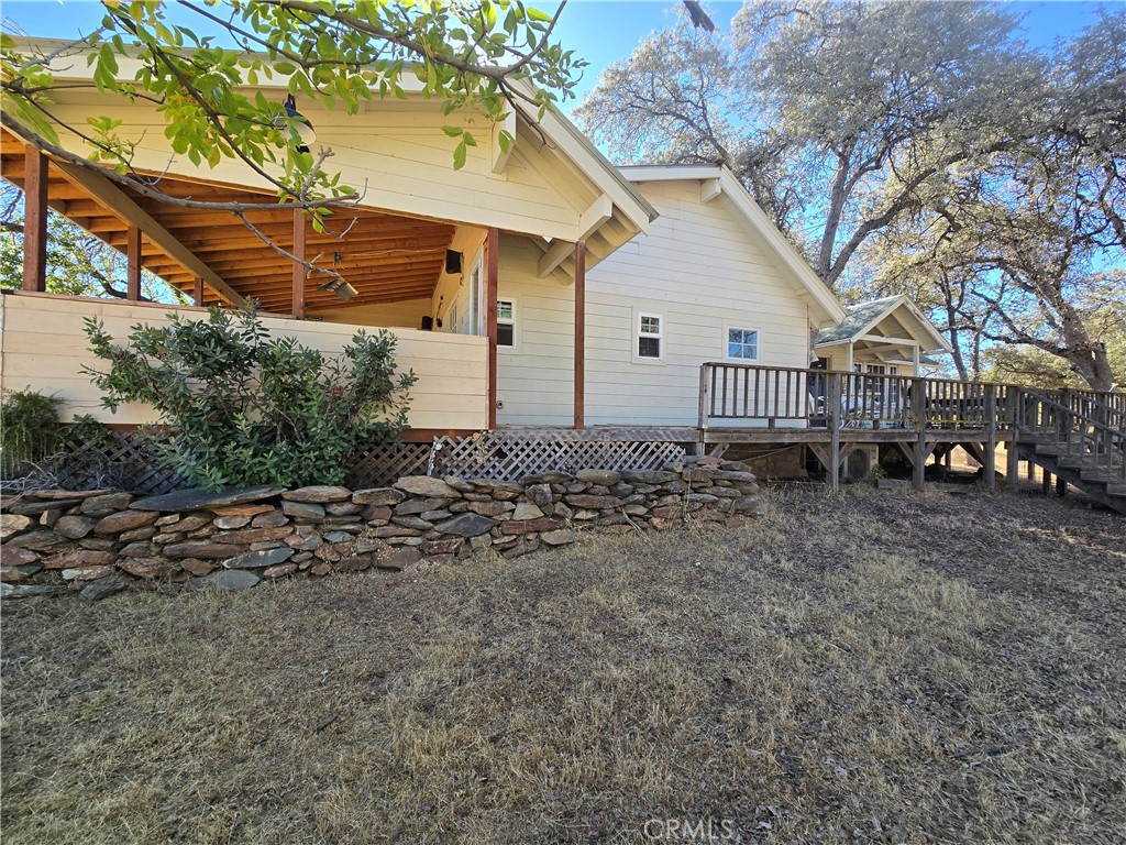 5963 Schilling Road Coulterville, CA 95311 - Photo 6 of 75 a view of a house with a yard and hanging chair