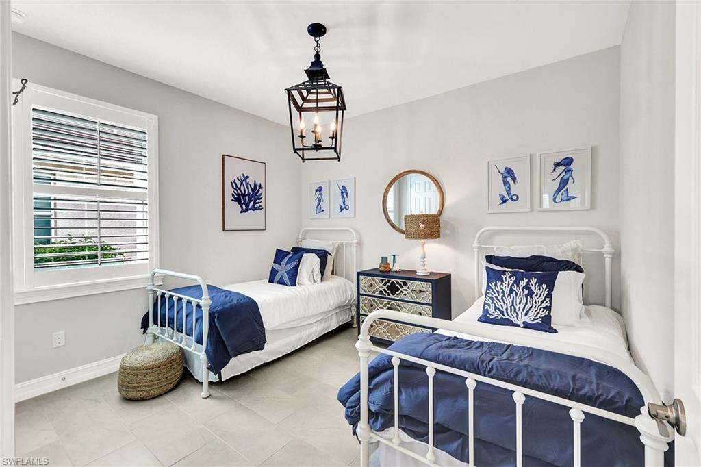 267 Tamarindo Lane Naples, FL 34114 - Photo 23 of 45 a bedroom with furniture and a window