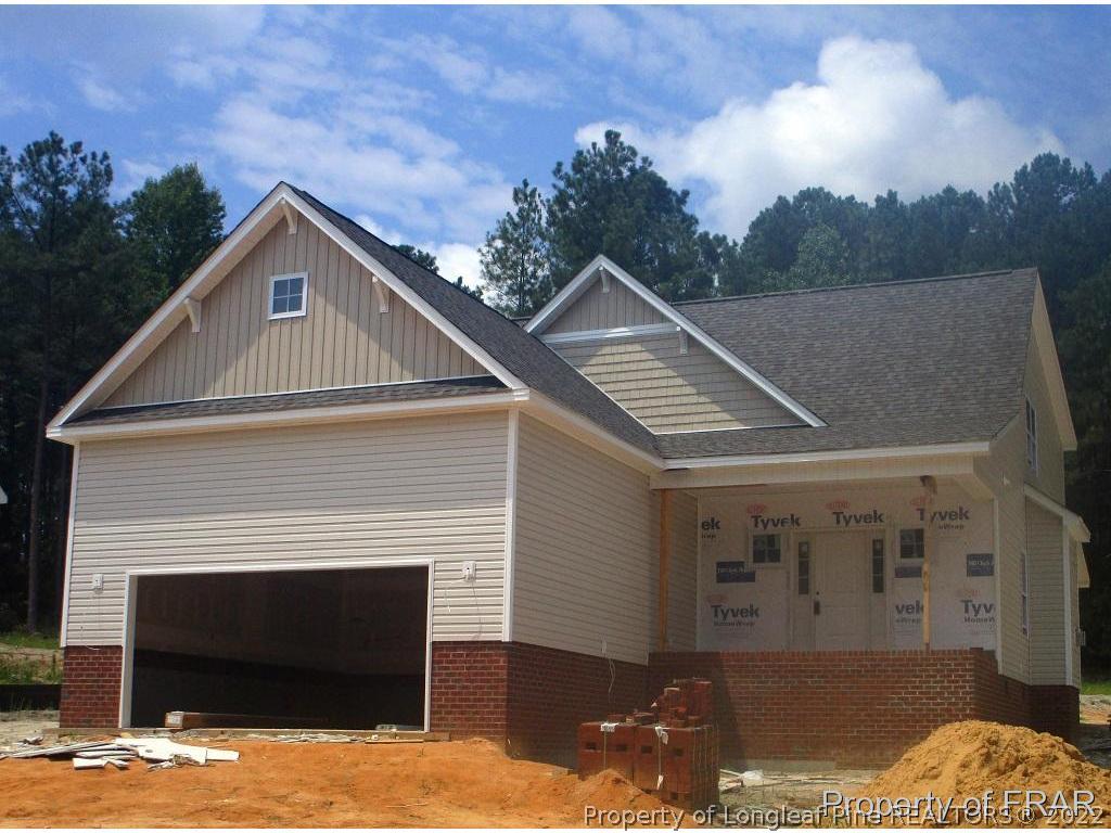 145 Dicks Hill Road Carthage, NC 28327 - Photo 1 of 4 a front view of a house with a yard