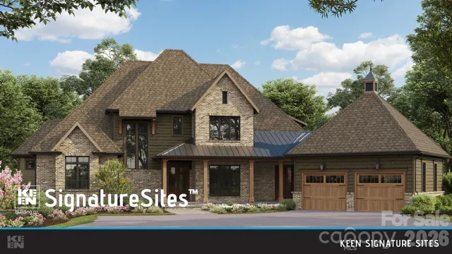 a view of a white house with large windows and a small yard