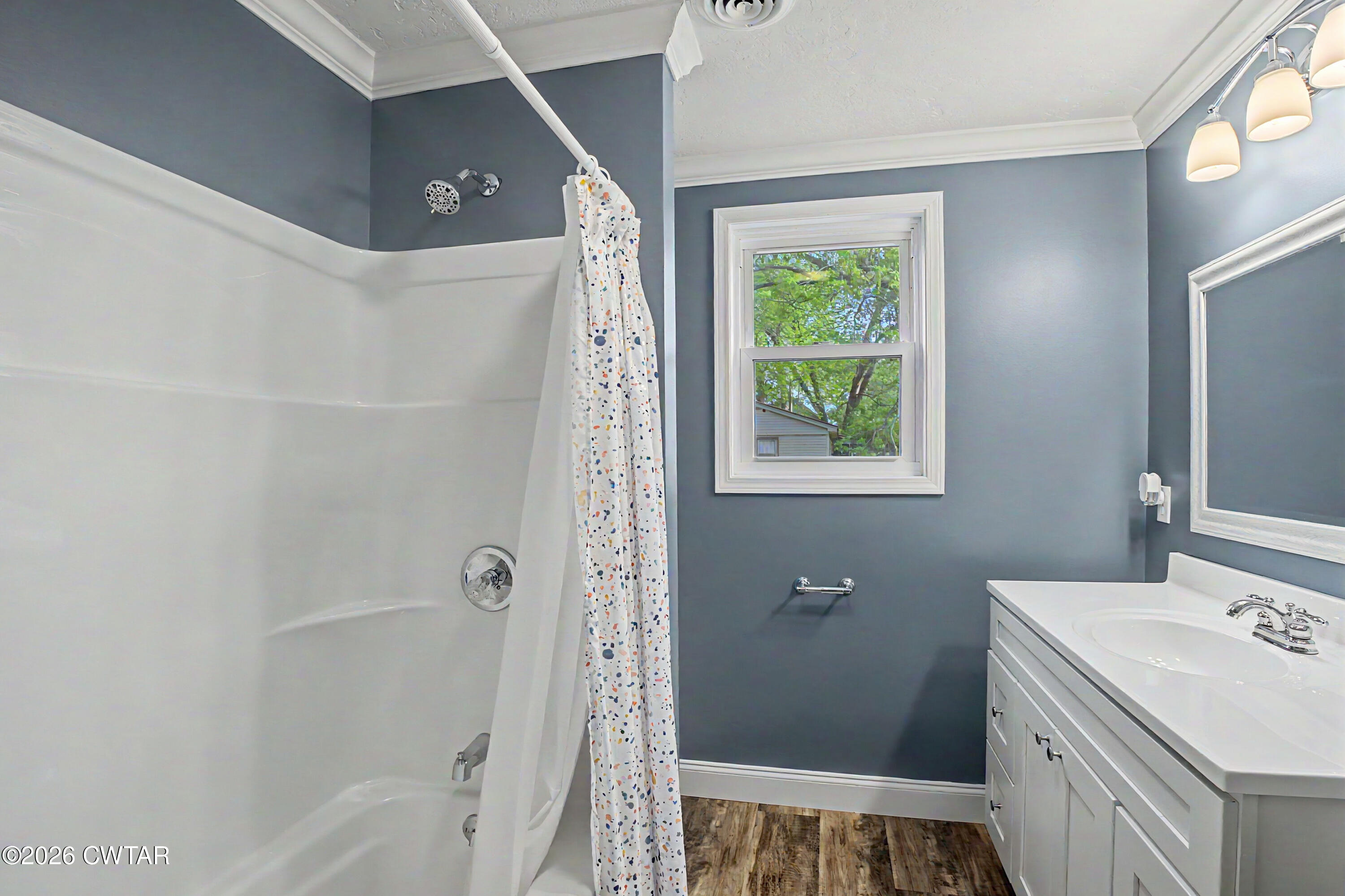 113 Church Street Gleason, TN 38229 - Photo 18 of 21 a bathroom with a sink a toilet and shower