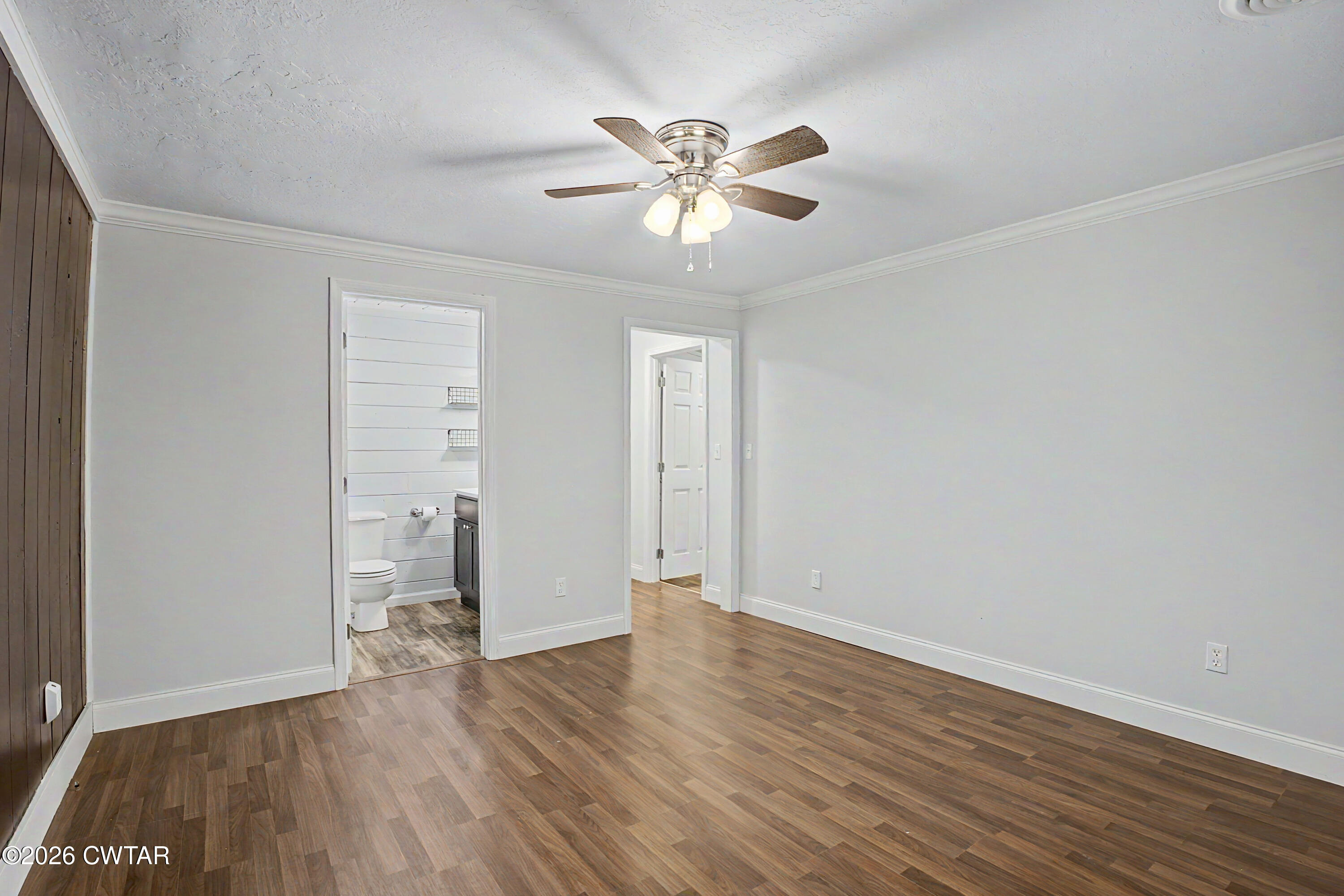 113 Church Street Gleason, TN 38229 - Photo 20 of 21 wooden floor in an empty room with a window