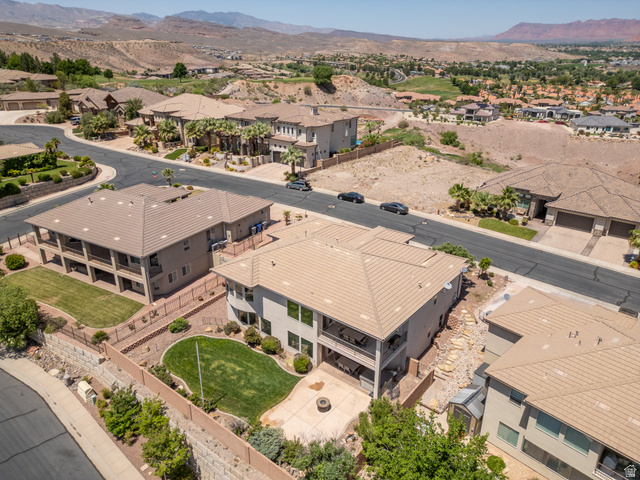 2005 West 450 S Circle St. George, UT 84770 - Photo 46 of 57 Expansive backyard featuring a manicured lawn, paved patio, and perimeter fencing