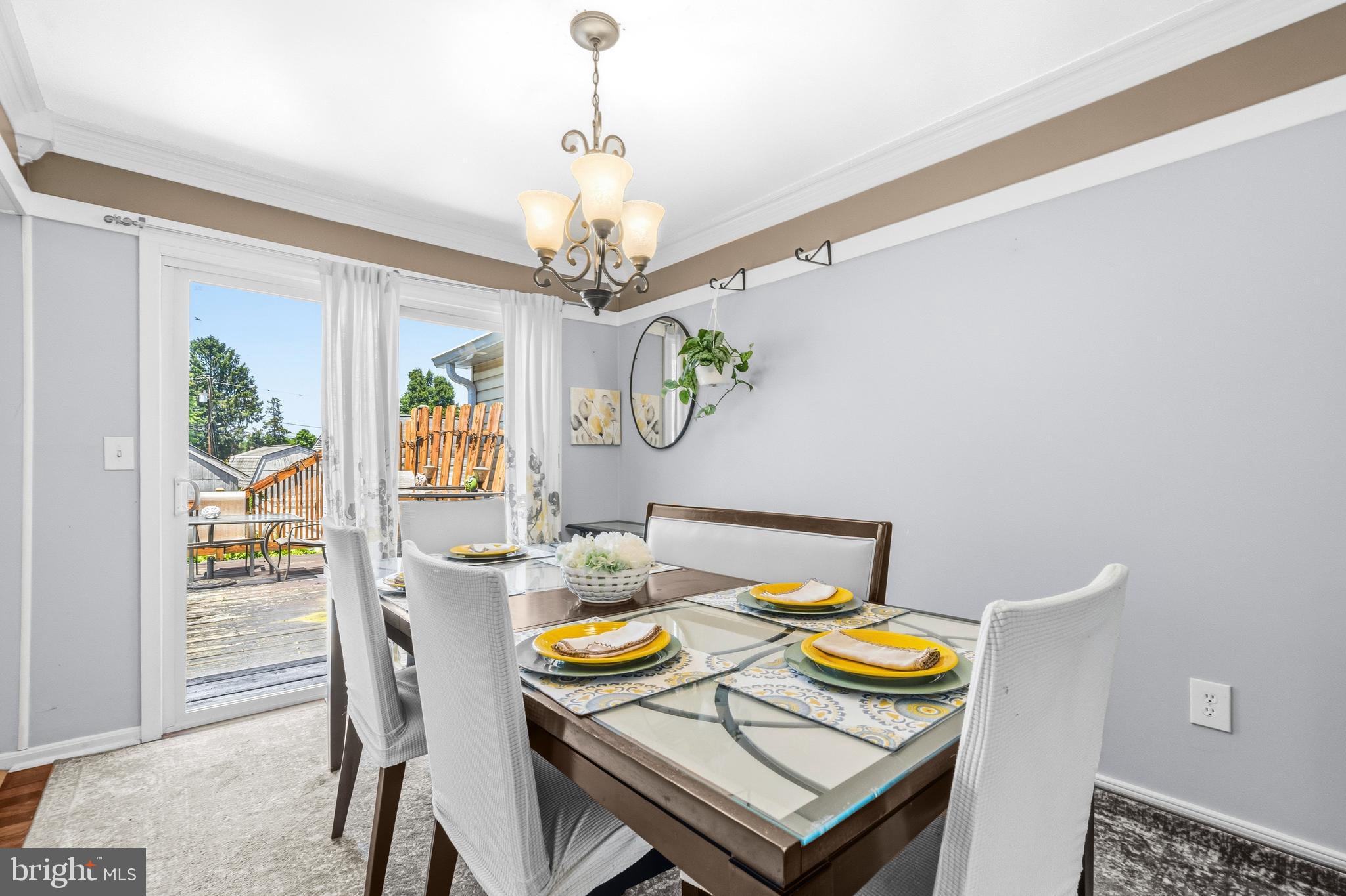 236 Inlet Drive Pasadena, MD 21122 - Photo 8 of 33 a view of a dining room with furniture a chandelier and wooden floor