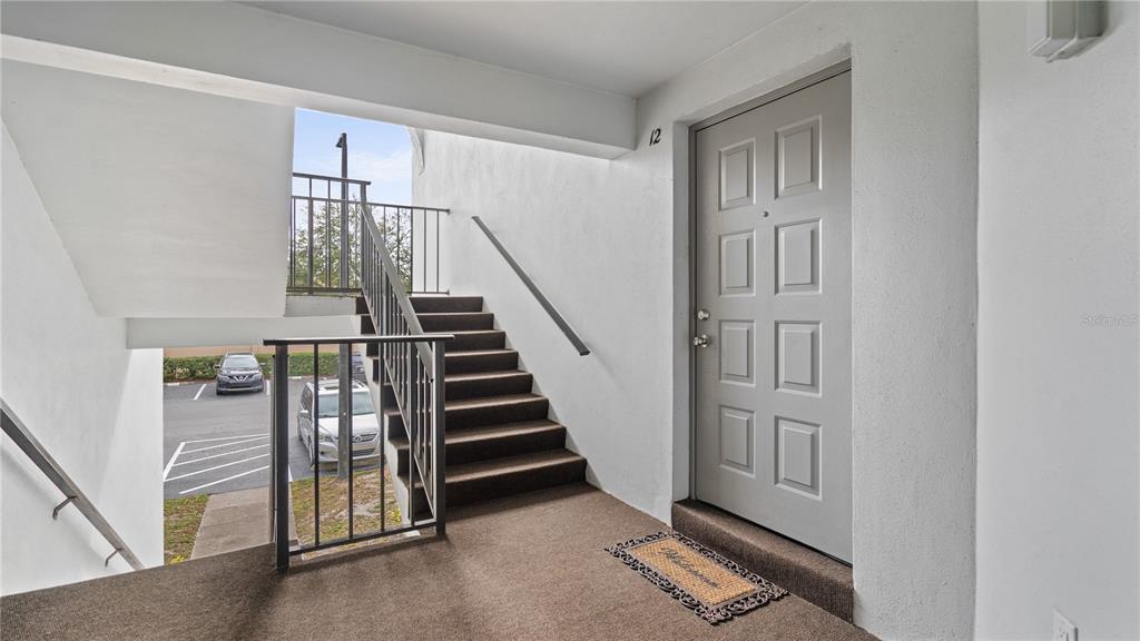 8203 Sun Spring Circle, Unit 12 Orlando, FL 32825 - Photo 32 of 38 a view of front door with stairs