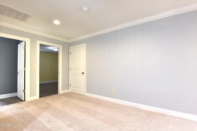 a spacious bathroom with a sink vanity and mirror