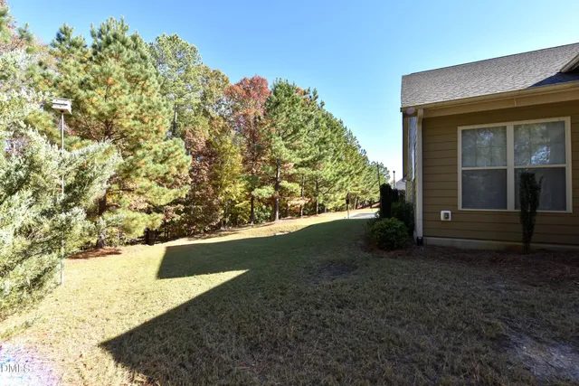 a view of empty room with large windows
