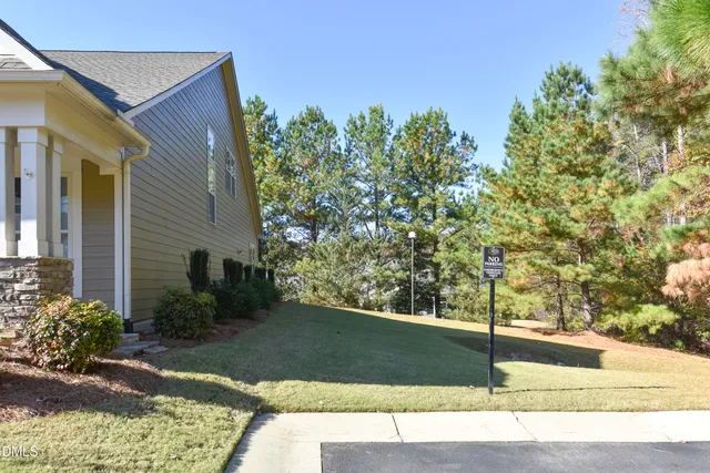 a view of a house with a yard and balcony