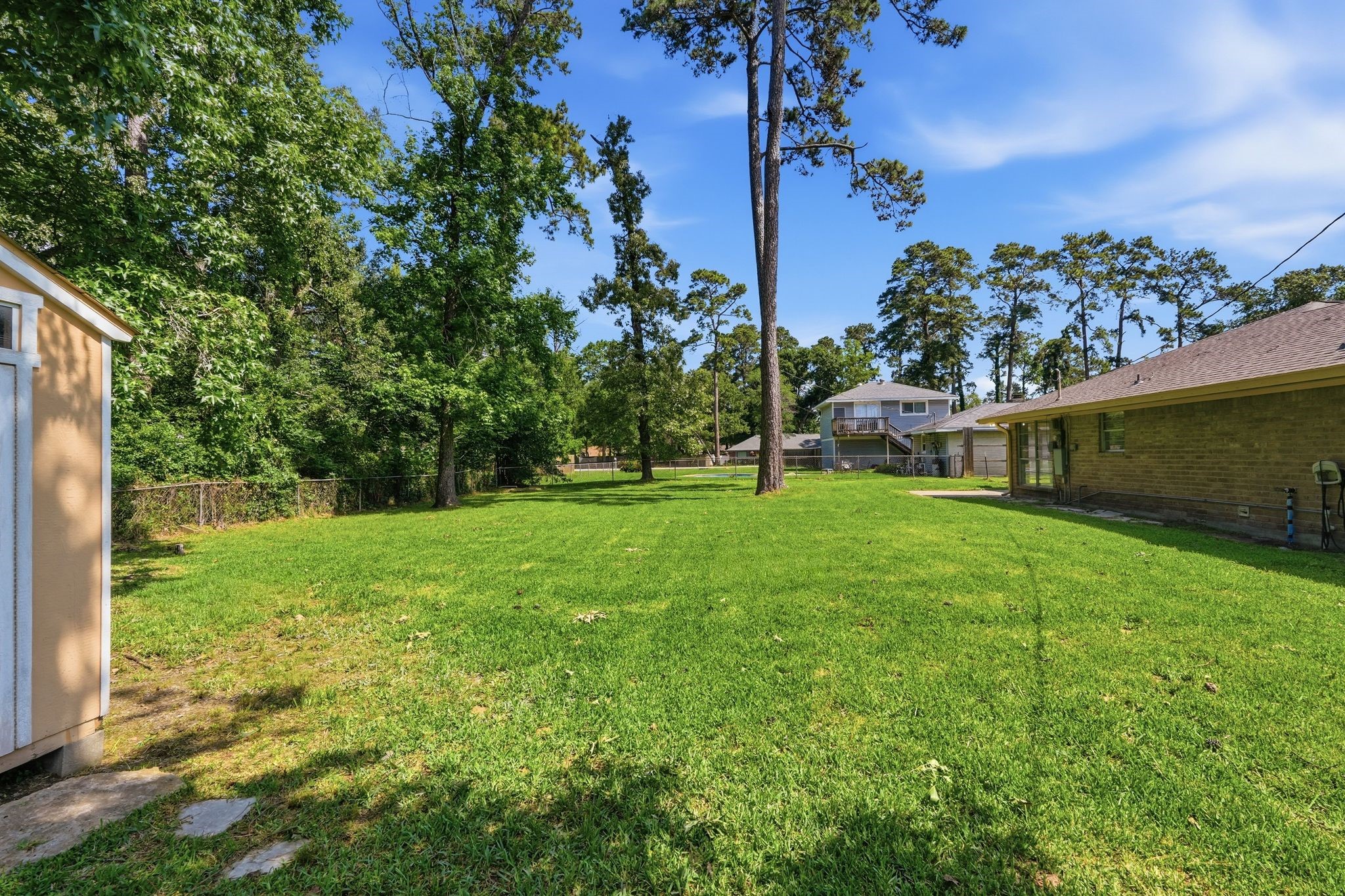 25611 Timberlane Drive Spring, TX 77386 - Photo 34 of 38 a view of a house with a backyard