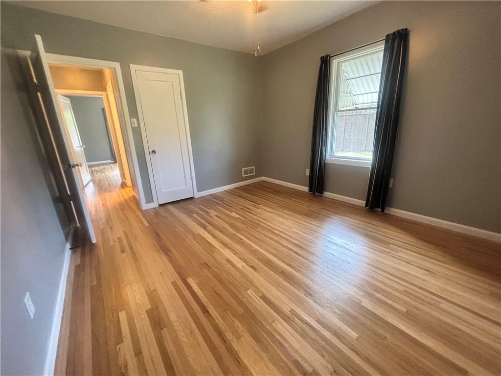 26 Mt View Drive Burgettstown, PA 15021 - Photo 21 of 45 a view of an empty room with wooden floor and a window