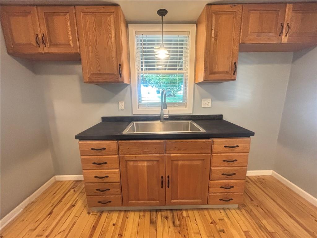 26 Mt View Drive Burgettstown, PA 15021 - Photo 25 of 45 a kitchen with granite countertop a sink cabinets and wooden floor