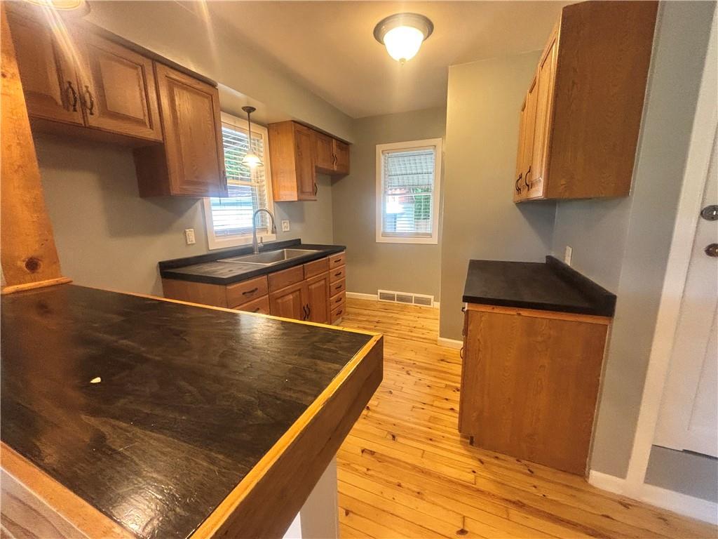 26 Mt View Drive Burgettstown, PA 15021 - Photo 26 of 45 a kitchen with stainless steel appliances granite countertop a sink stove and refrigerator