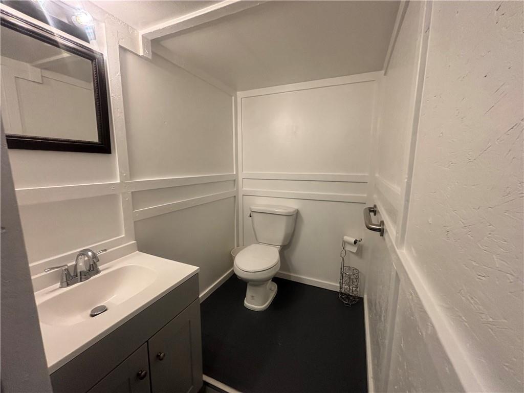 26 Mt View Drive Burgettstown, PA 15021 - Photo 32 of 45 a bathroom with a toilet a sink and mirror