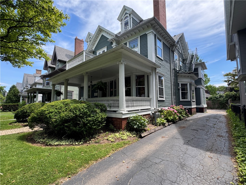 106 Argyle Street Rochester, NY 14607 - Photo 50 of 50 Side view of home looking towards East Ave. showing driveway and an example of the many porches.