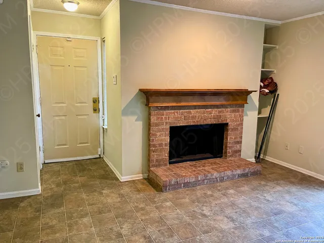 an empty room with a fireplace