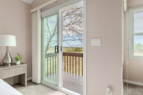 a view of a balcony with wooden floor